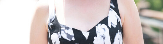 Heather smiling during an outdoor summer portrait session in Newton, MA